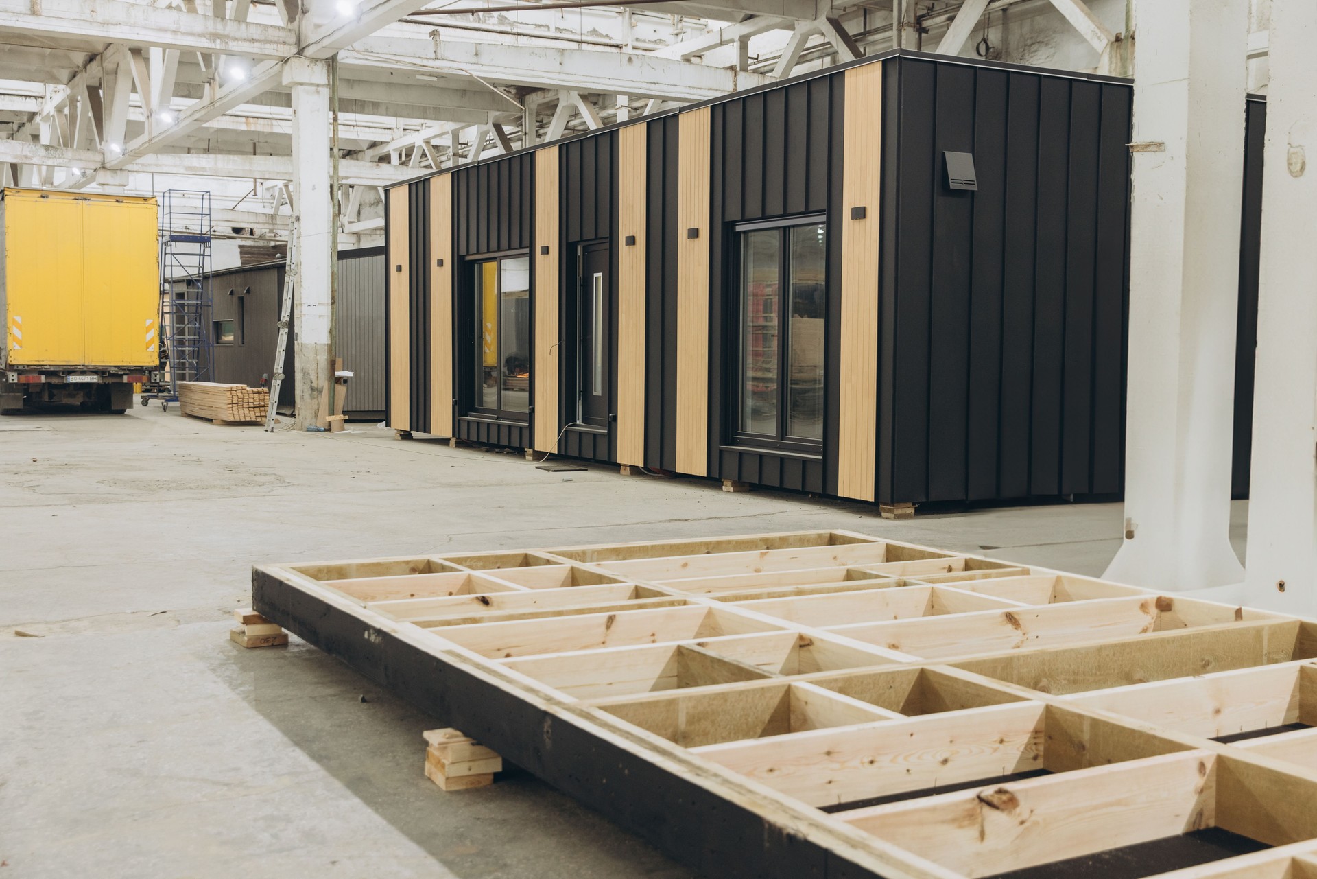 Modular building under construction in a large factory
